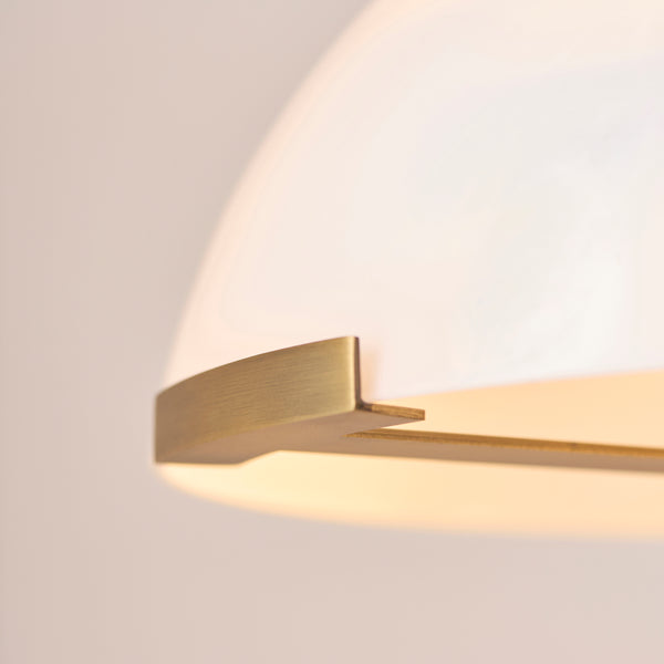 Detail of the warm brass and grey marble finish on the Hansel Table Lamp