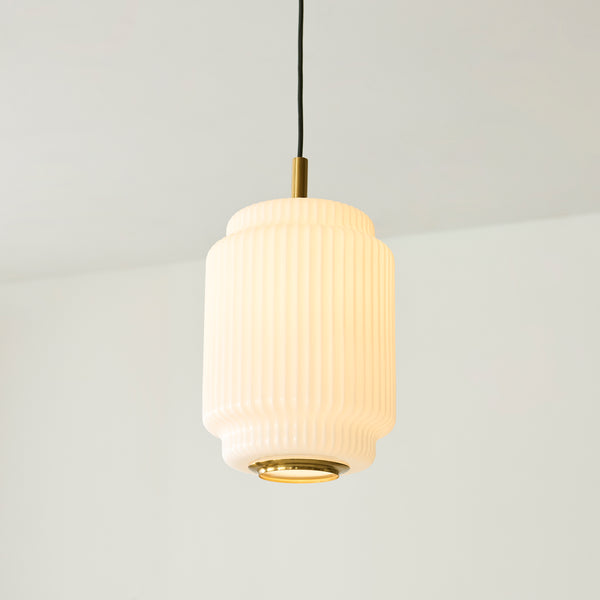 Evora Small Pendant lit up in a styled kitchen