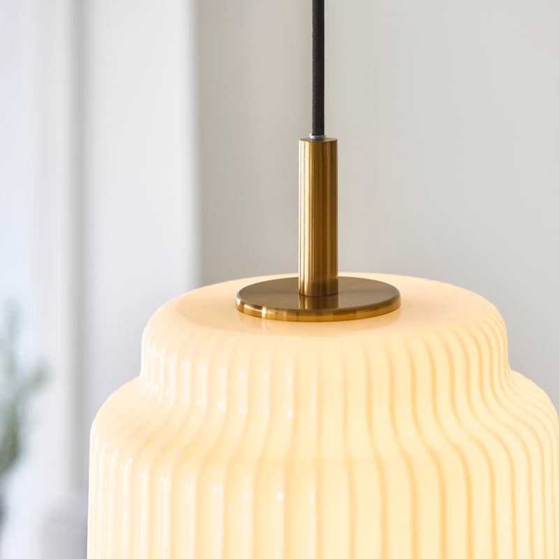 Detail of the brushed aged brass finish on the Evora Small Pendant