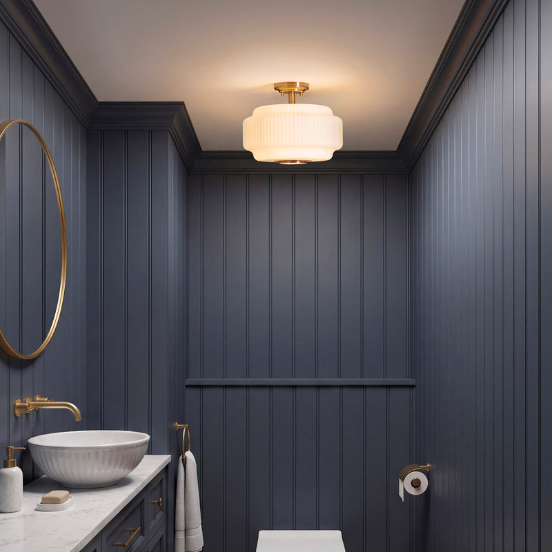 Evora Flush Ceiling Light in brushed aged brass on a hallway ceiling