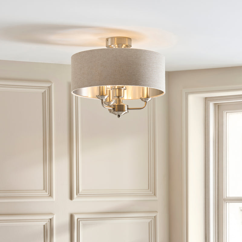 Highclere 3 Light Flush Ceiling Light lit up in a styled bedroom
