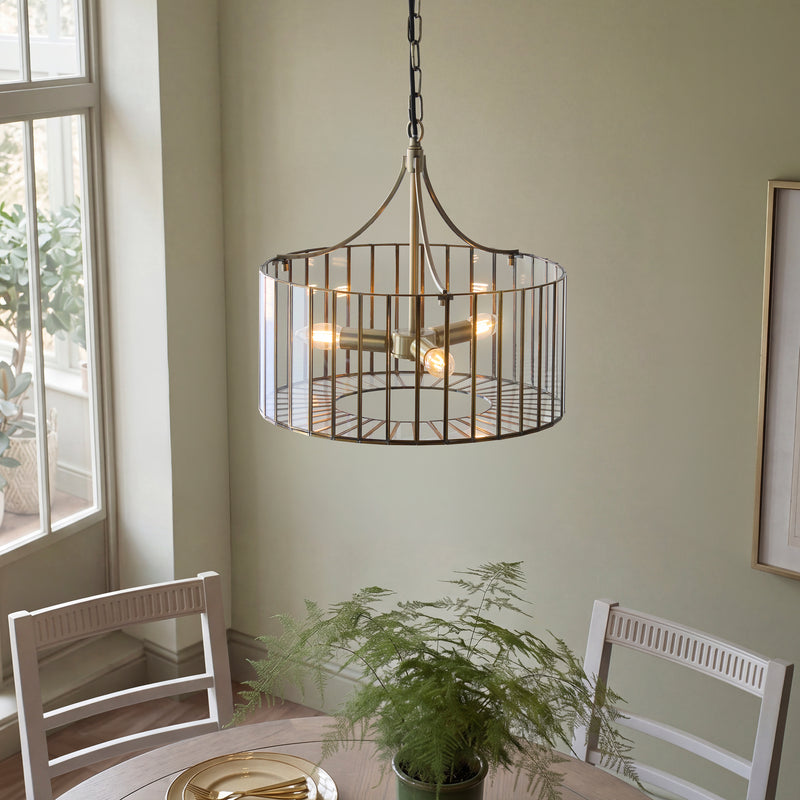 Antalya 3 Light Pendant in antique solid brass shown in a room setting