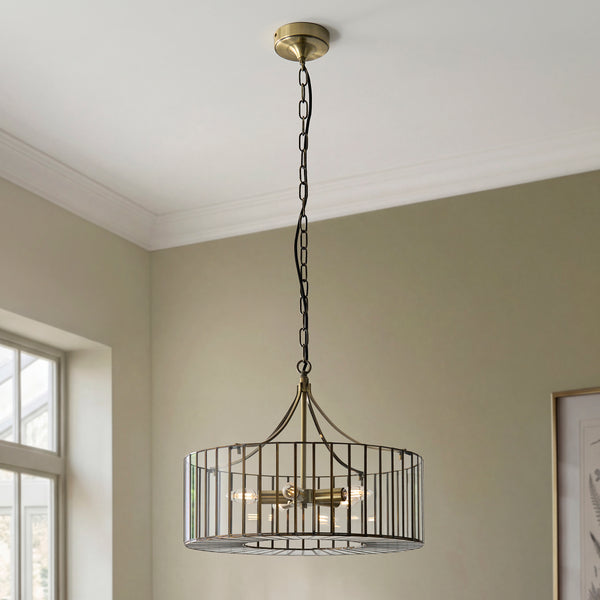 Antalya 5 Light Pendant lit up in a styled dining room
