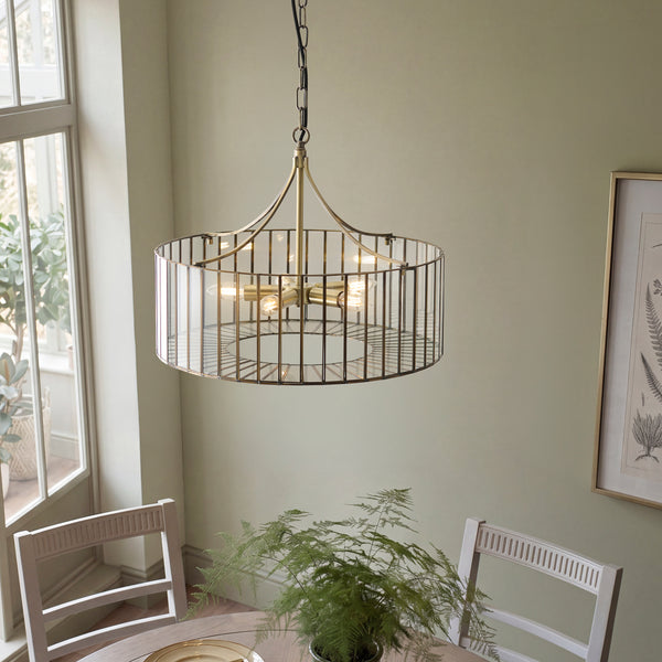 Antalya 5 Light Pendant in antique solid brass shown in a room setting