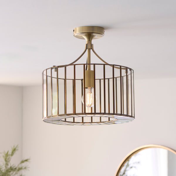 Antalya Flush Ceiling Light in antique solid brass on a hallway ceiling