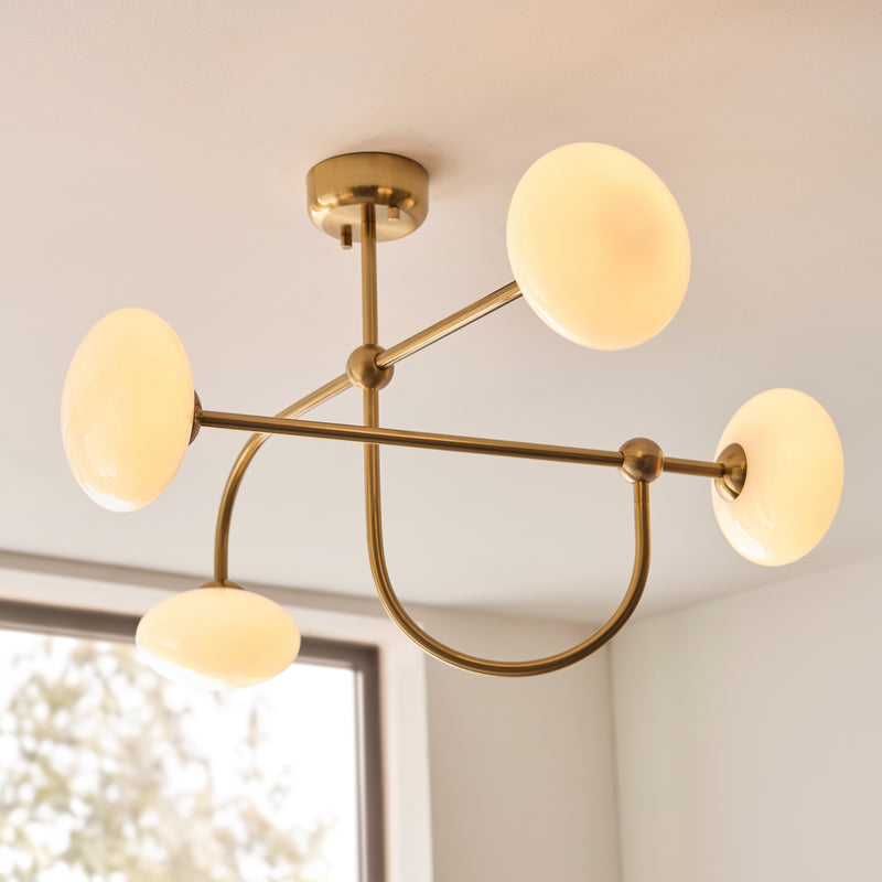 Ottowa 4 Light Semi Flush Ceiling Light lit up in a styled living room