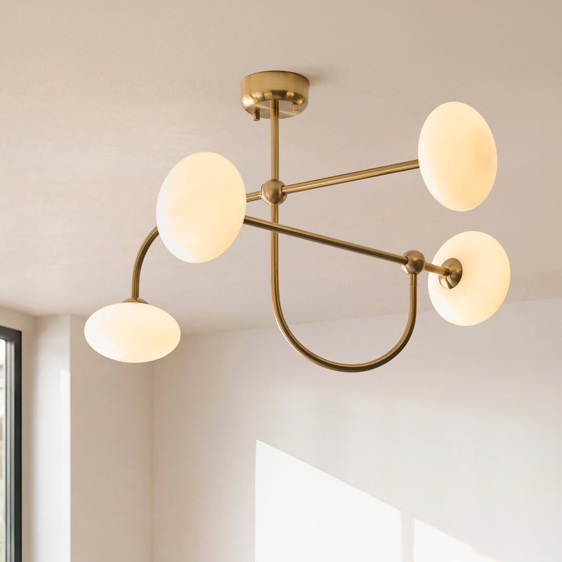 Ottowa 4 Light Semi Flush Ceiling Light in brushed aged brass shown in a room setting