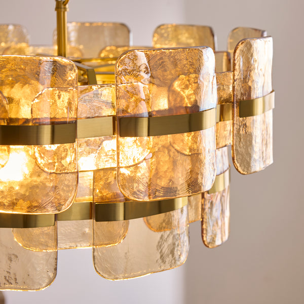 Ancara 6 Light Pendant in brushed aged brass shown in a room setting