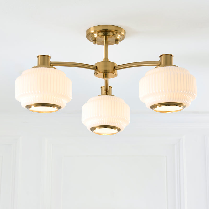 Evora 3 Light Semi Flush Ceiling Light lit up in a styled bedroom