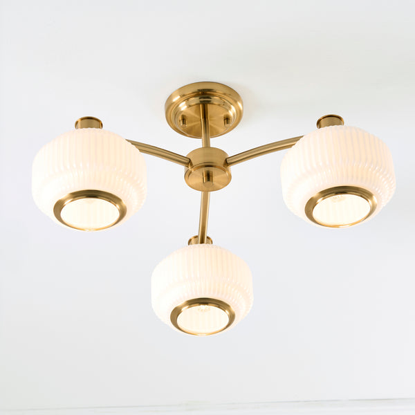 Evora 3 Light Semi Flush Ceiling Light in brushed aged brass shown in a room setting