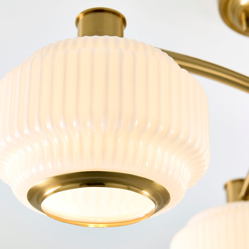 Detail of the brushed aged brass finish on the Evora 3 Light Semi Flush Ceiling Light
