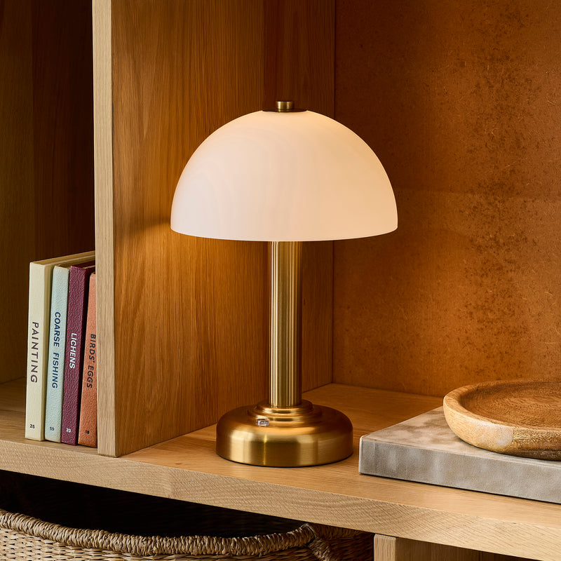 Endon Bridport Rechargeable Table Lamp in warm brass in a styled dining room
