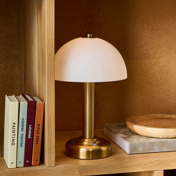 Bridport Rechargeable Table Lamp lit up in a dining room setting