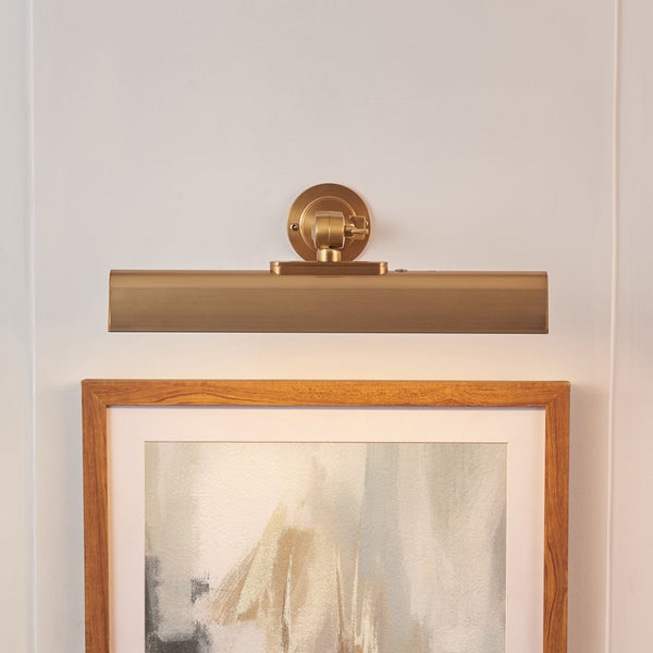 Dalyan Rechargeable Picture Light lit up in a styled living room