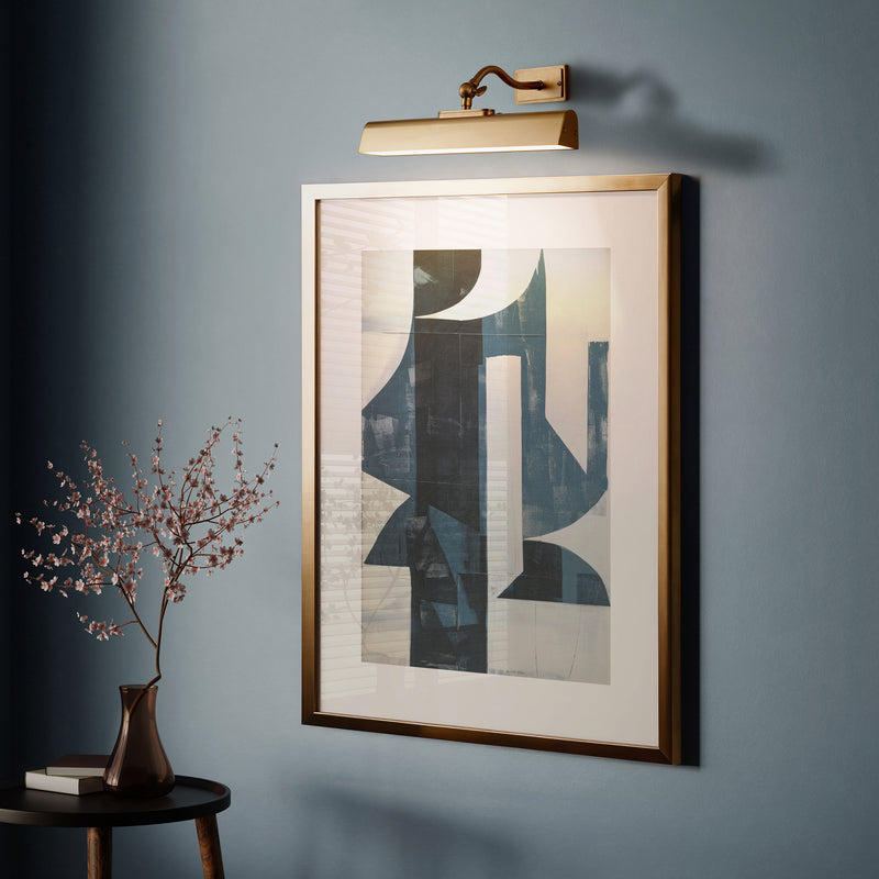 Lasos Rechargeable Picture Light lit up in a styled living room