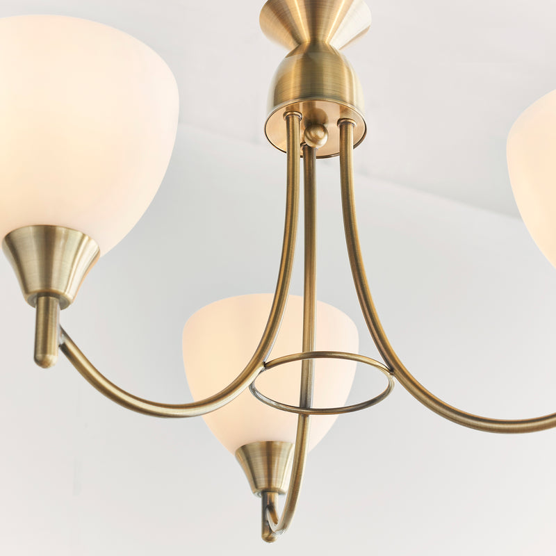 Alton 3 Light Pendant in antique brass shown in a room setting