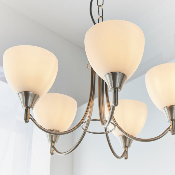 Alton 5 Light Pendant lit up in a styled living room