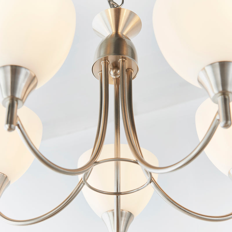 Alton 5 Light Pendant in satin chrome shown in a room setting