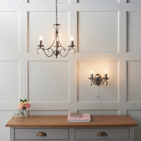 Bernice 3 Light Chandelier in antique brass shown in a room setting