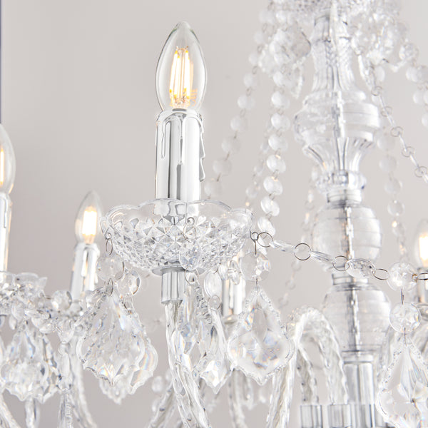 Clarence 8 Light Chandelier lit up in a styled living room
