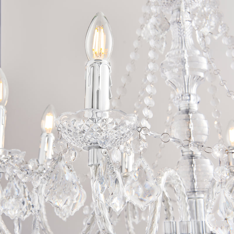 Clarence 8 Light Chandelier lit up in a styled living room