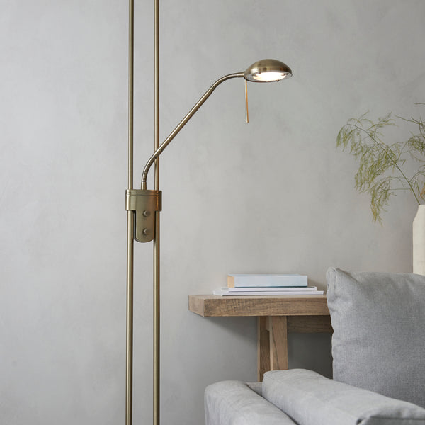 Detail of the antique brass finish on the Rome Mother and Child Floor Lamp