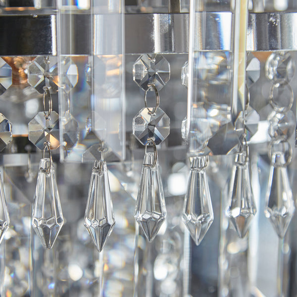 Amadis crystal pendant close up showing polished chrome frame and crystal detailing