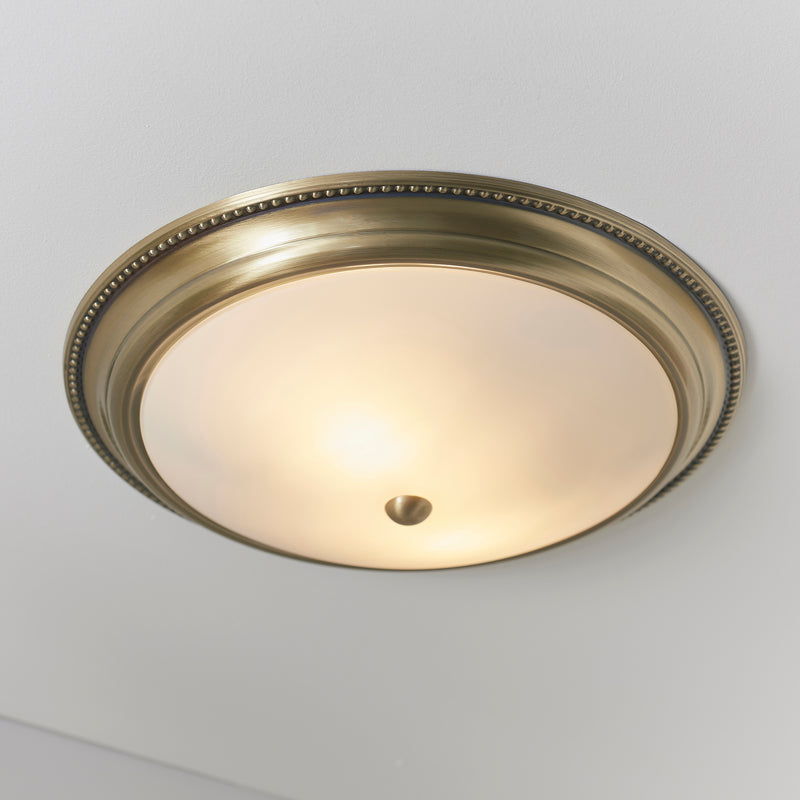 Atlas 2 Light Flush Ceiling Light lit up in a styled hallway