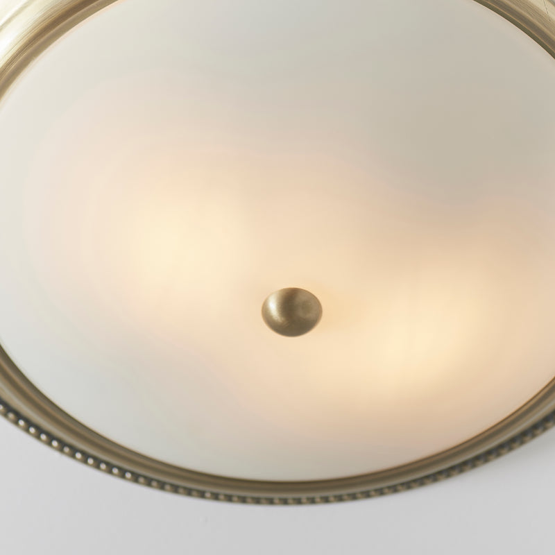 Detail of the antique brass finish on the Atlas 2 Light Flush Ceiling Light