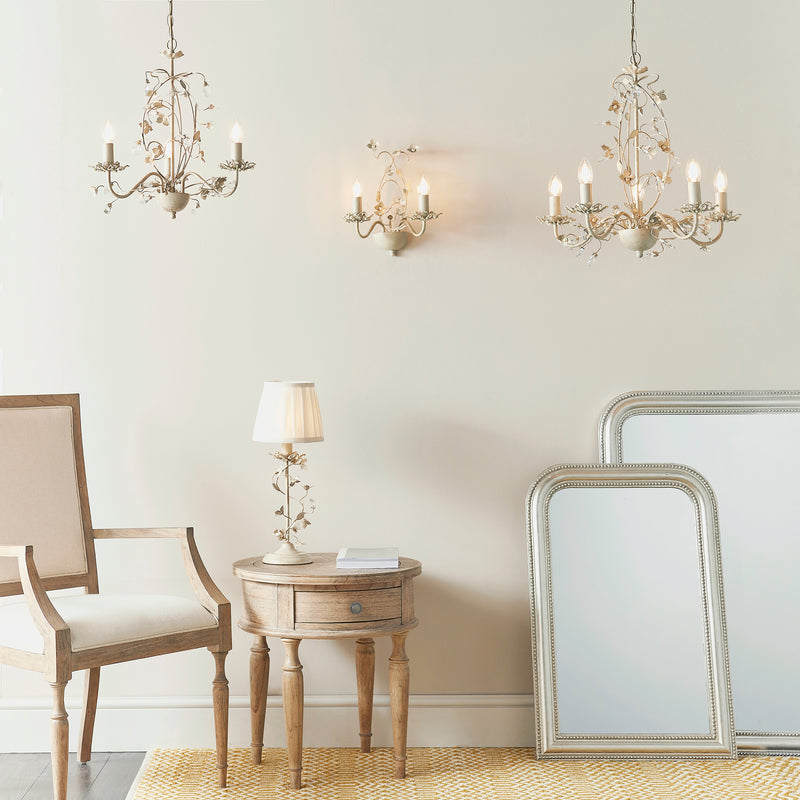 Lullaby 3 Light Chandelier lit up in a styled bedroom