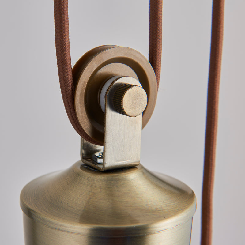 Close-up of the metalwork on the Polka Rise and Fall Pendant