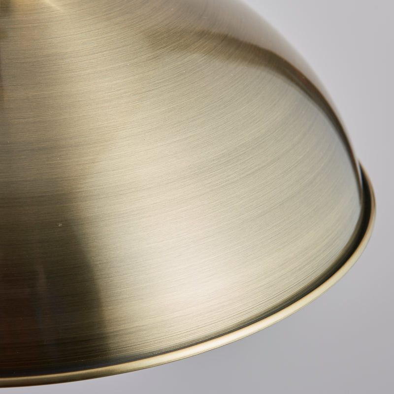 Detail of the antique brass finish on the Polka Rise and Fall Pendant