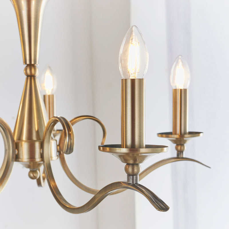 Detail of the antique brass finish on the Kora 5 Light Chandelier