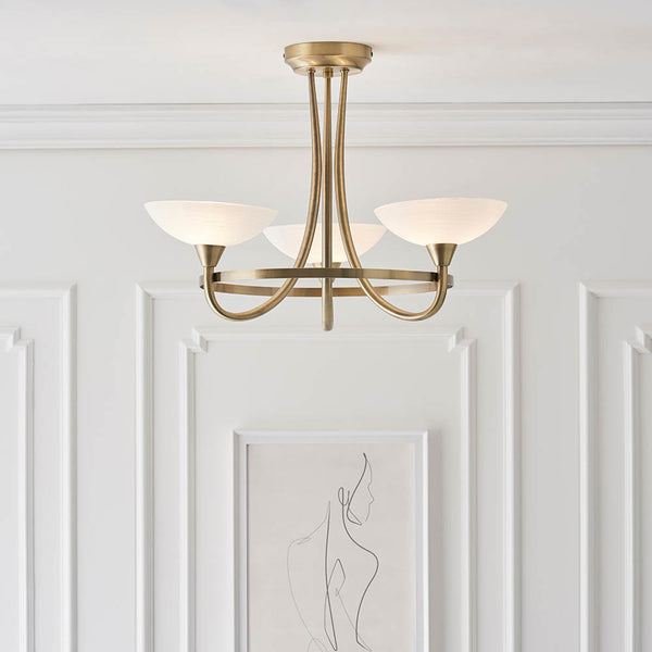 Cagney 3 Light Semi Flush Ceiling Light in antique brass on a bedroom ceiling