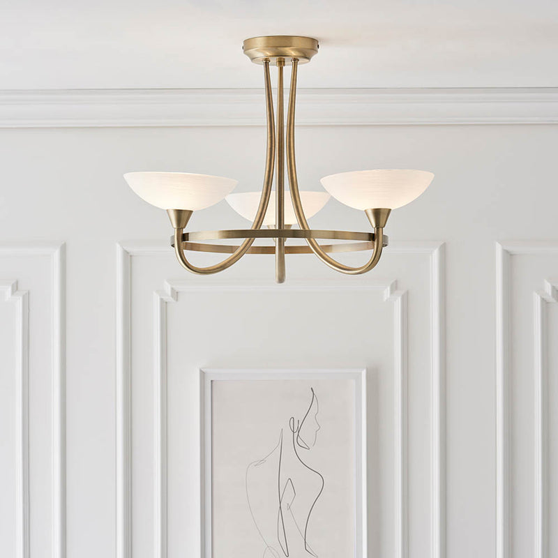 Cagney 3 Light Semi Flush Ceiling Light in antique brass on a bedroom ceiling