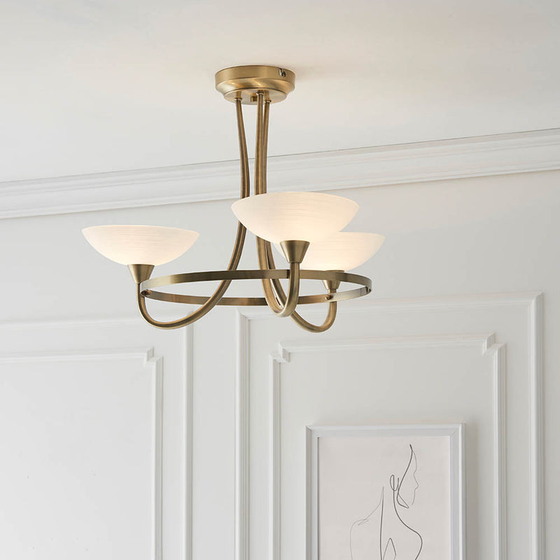 Cagney 3 Light Semi Flush Ceiling Light lit up in a styled bedroom