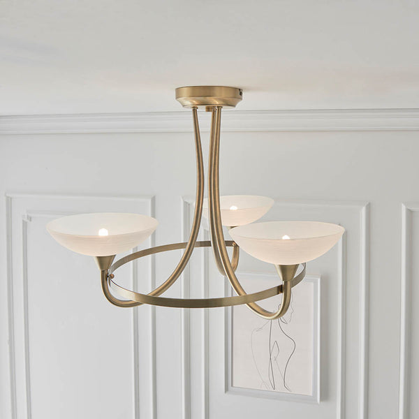 Cagney 3 Light Semi Flush Ceiling Light in antique brass shown in a room setting