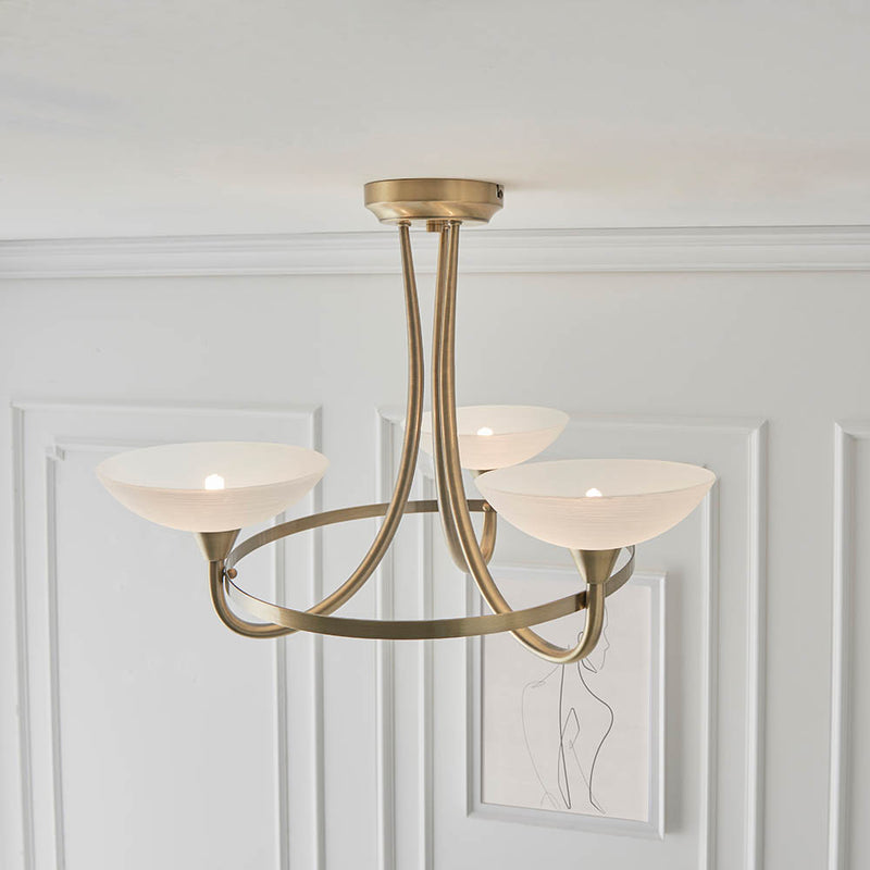 Cagney 3 Light Semi Flush Ceiling Light in antique brass shown in a room setting
