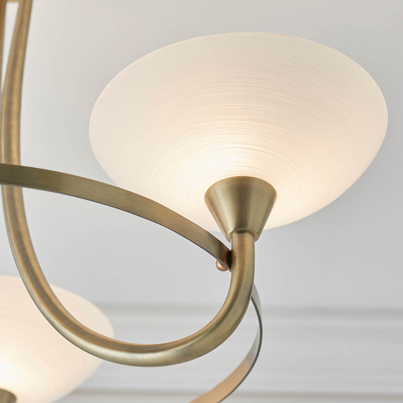 Detail of the antique brass finish on the Cagney 3 Light Semi Flush Ceiling Light