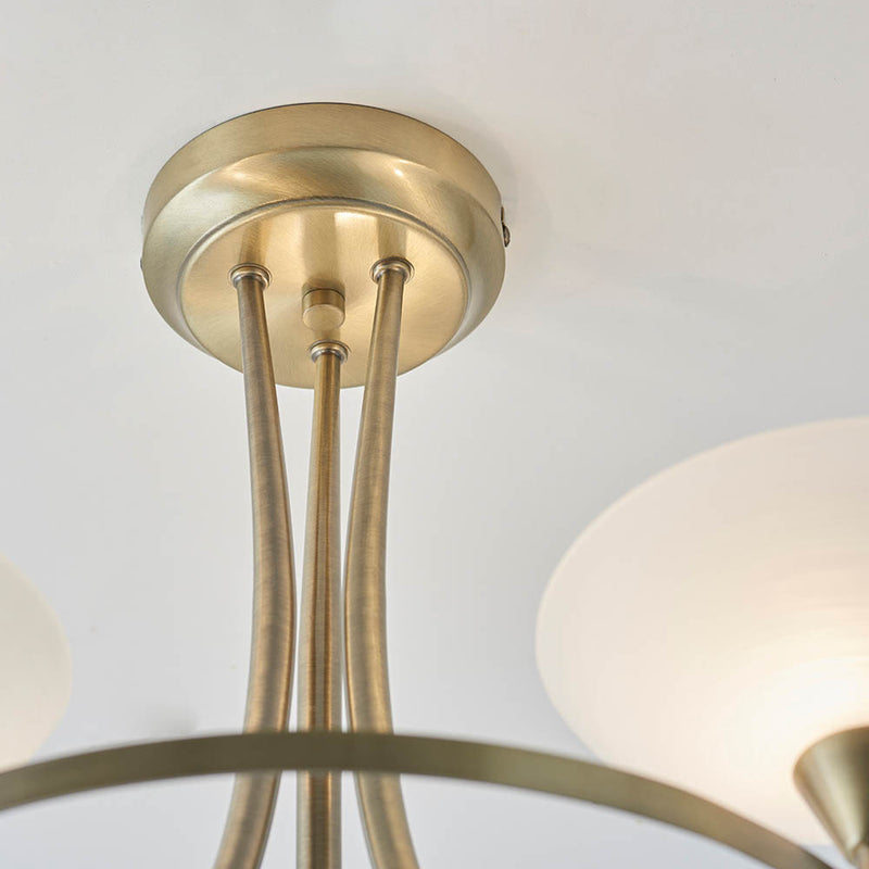 Close-up of the Cagney 3 Light Semi Flush Ceiling Light ceiling plate and fittings