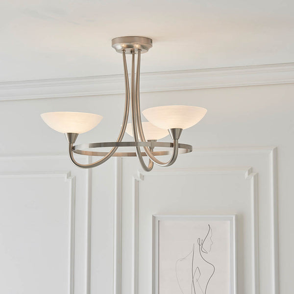 Cagney 3 Light Semi Flush Ceiling Light lit up in a styled bedroom