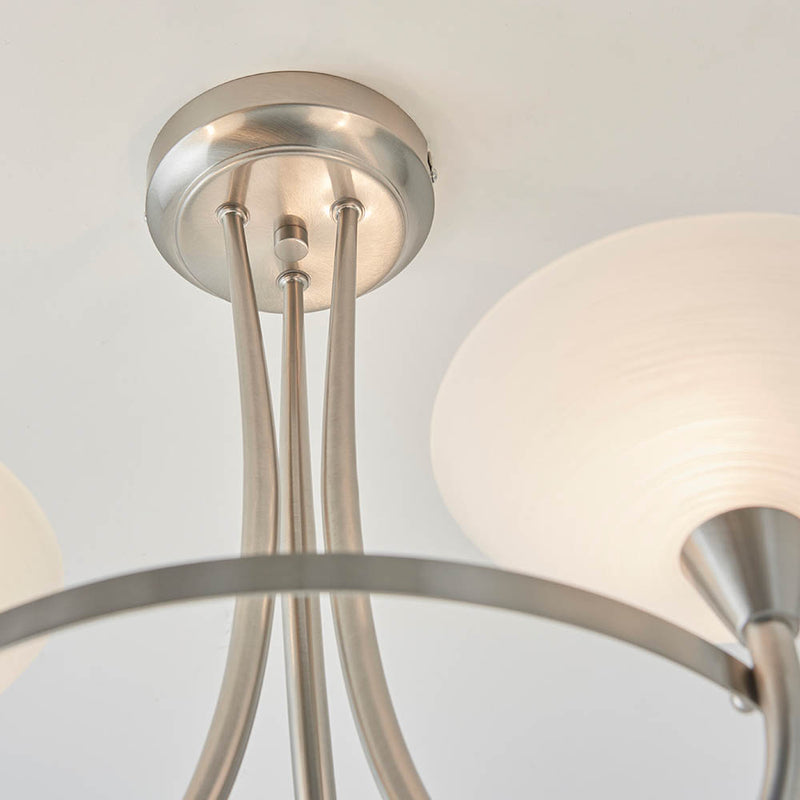 Close-up of the Cagney 3 Light Semi Flush Ceiling Light ceiling plate and fittings