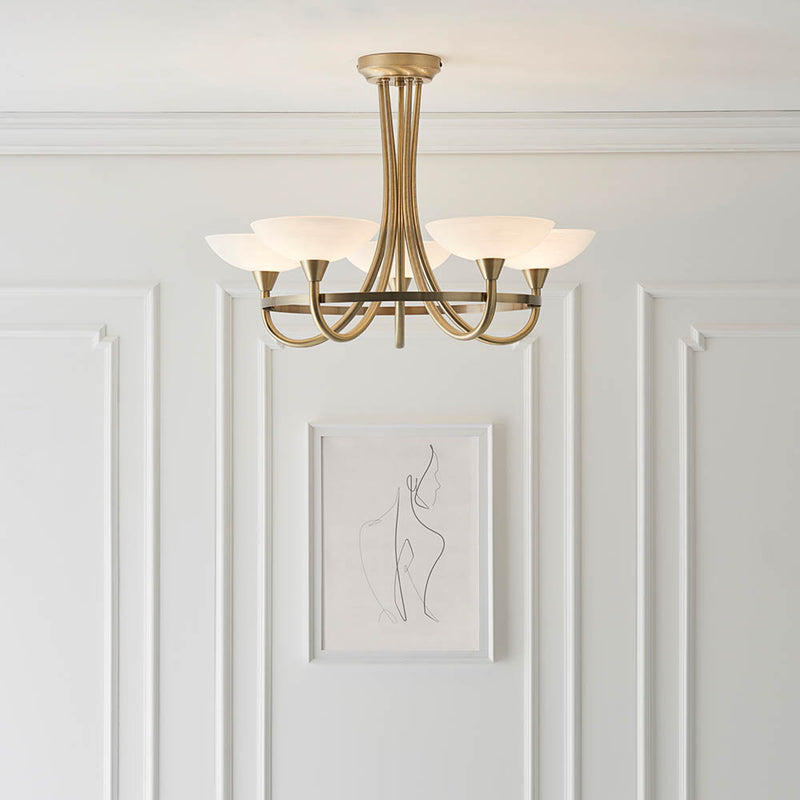 Cagney 5 Light Semi Flush Ceiling Light in antique brass on a living room ceiling