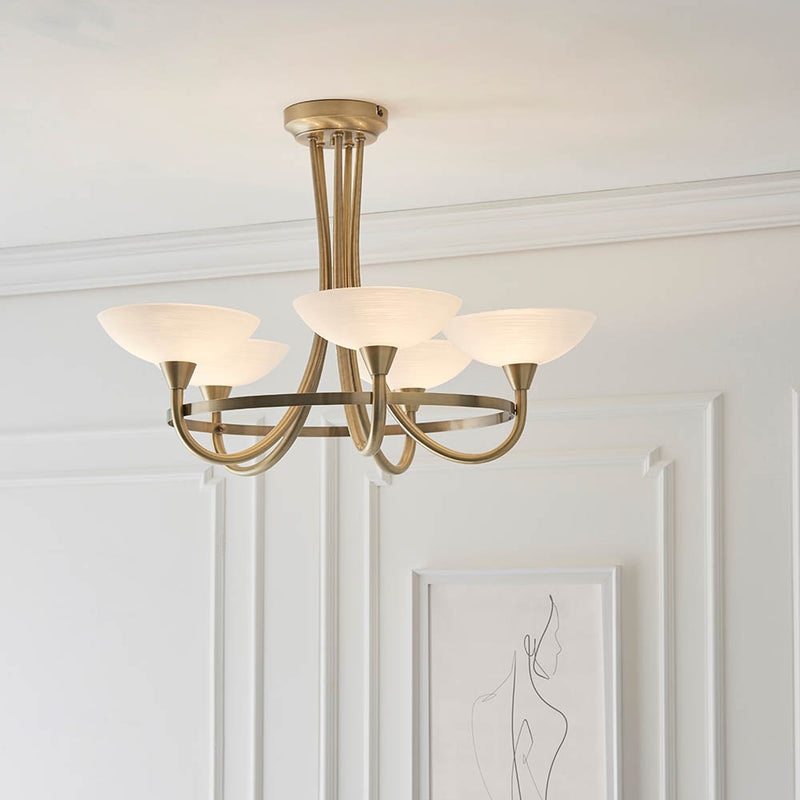 Cagney 5 Light Semi Flush Ceiling Light in antique brass shown in a room setting