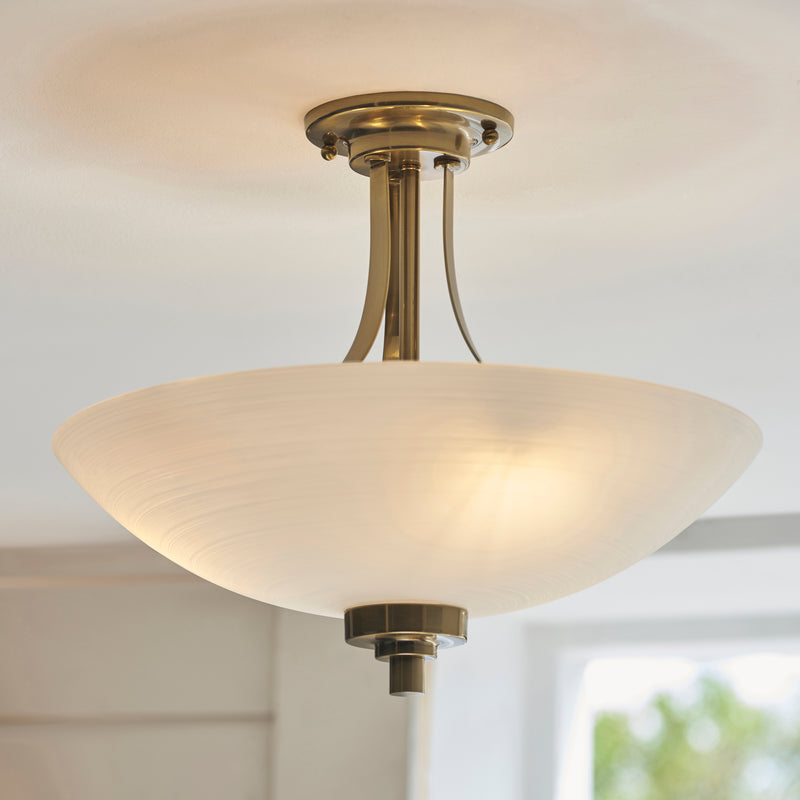Welles 3 Light Semi Flush Ceiling Light in antique brass on a bedroom ceiling
