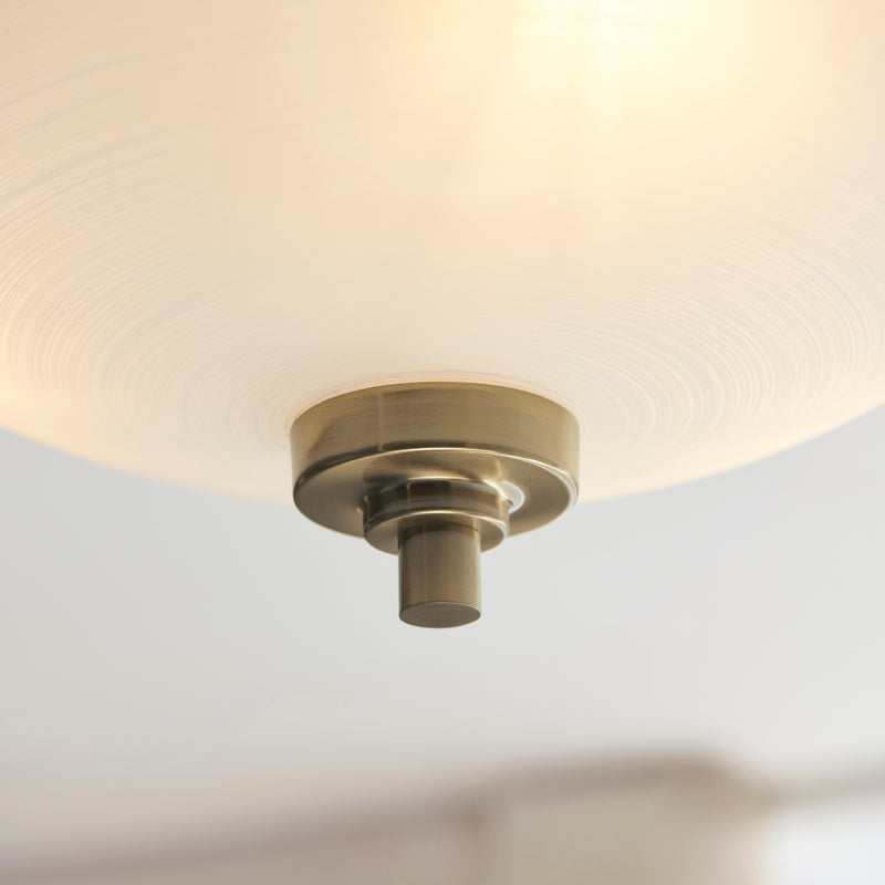 Welles 3 Light Semi Flush Ceiling Light in antique brass shown in a room setting
