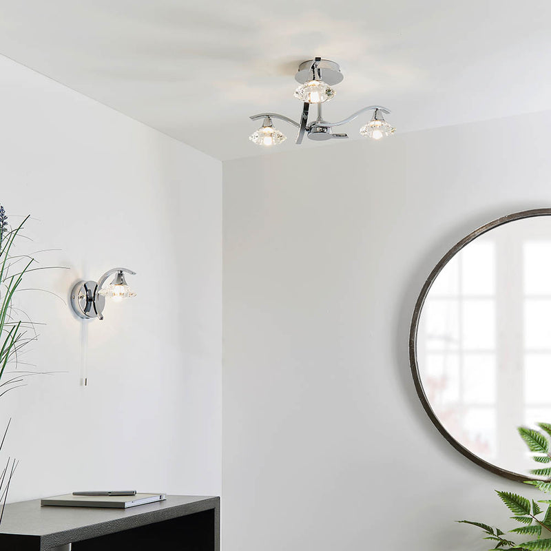 Langella 3 Light Crystal Semi Flush Ceiling Light lit up in a styled bedroom