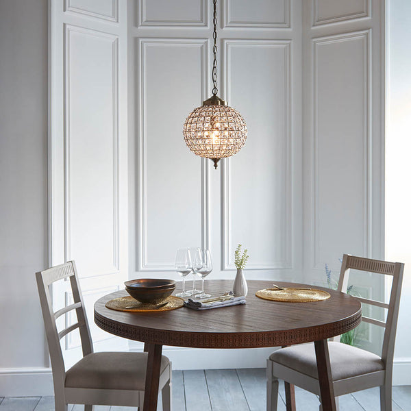 Tanaro Pendant lit up in a styled hallway