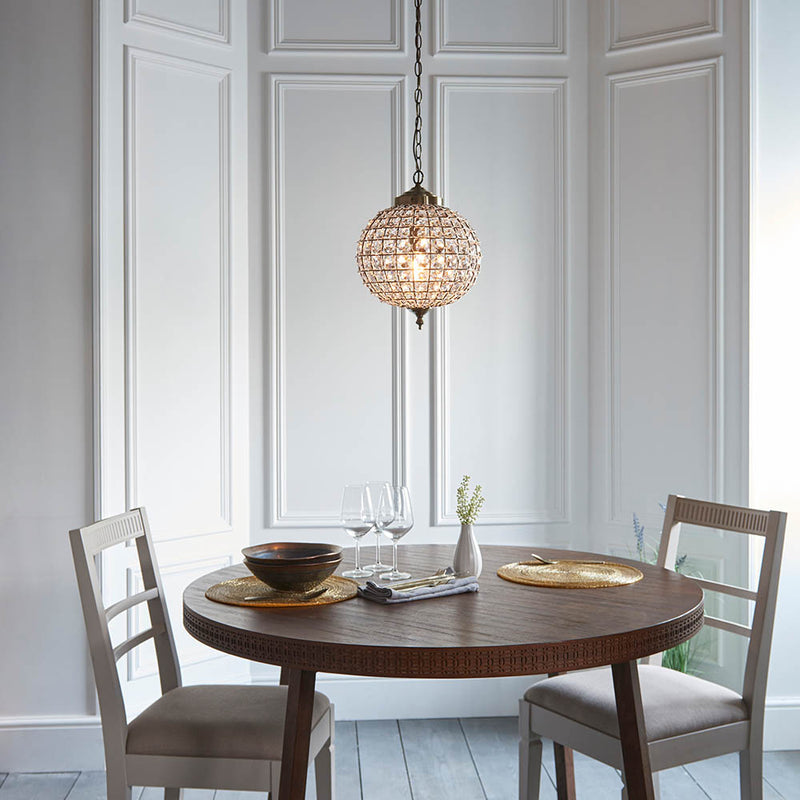 Tanaro Pendant lit up in a styled hallway