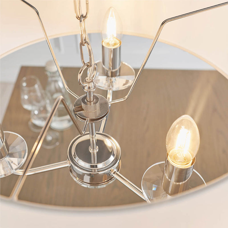 Nixon 3 Light Chandelier in bright nickel shown in a room setting